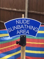 Nude sunbathing sign - nude, wind