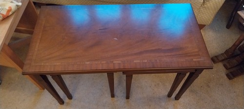 Modern mahogany nest - a, of