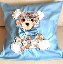 hand crafted  cushion with handsewn applique of a teddy Bear