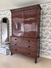 Antique mahogany linen press /