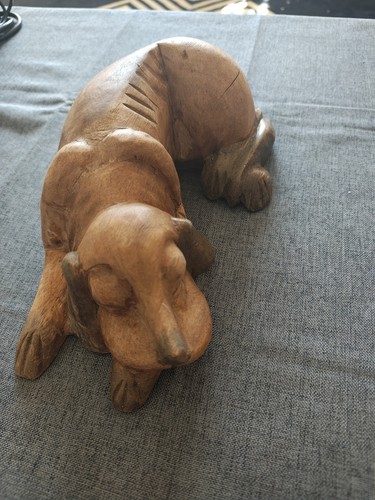 Hand carved sleeping dog - hand,