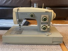 Cresta sewing machine with original case, foot pedal and instruction manual.