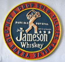 VINTAGE CAST IRON JOHN JAMESON