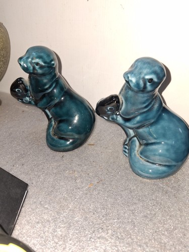Pair poole pottery seals - of,