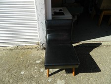 black leatherette & wooden legs lounge chair