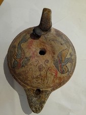 replica ancient terracotta oil lamp. Greek museum copy handmade