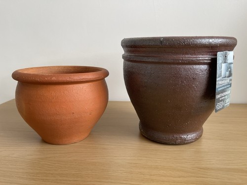 Two plant pots one unused - one,