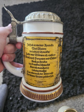 A German Beer Stien With A Pewter Lid