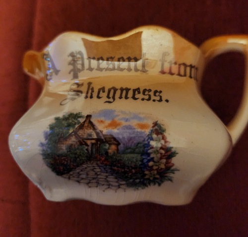 Small jug a present from - 'a,