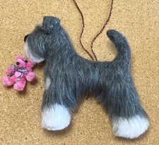 Schnauzer with pink teddy - , a