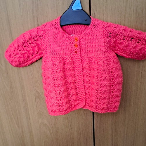 Pink hand knitted cable knit