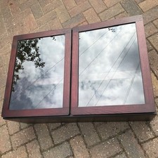 Two identical glass fronted display cabinets with 2 glass shelves and lights.