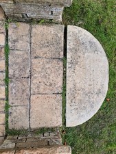 Semi circular sandstone patio entrance feature