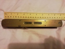 Vintage spirit level , wooden body with brass faces top and bottom , 9 inch