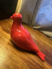 Striking red bird figurine