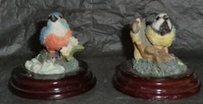 Bird ornaments on wooden plinths