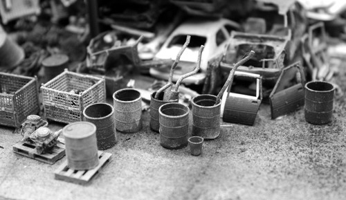 Dented oil drums - dented, open