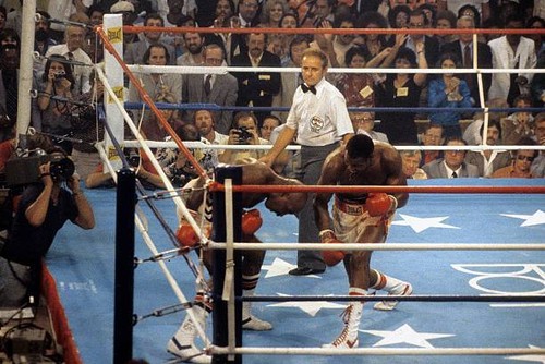 Larry holmes lands punch - a,