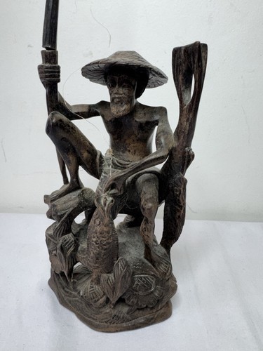 Bali wood carving fisherman
