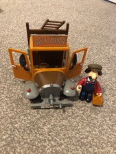 Vintage friction driven Ted Glen builders truck and figure
