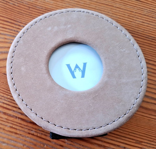 Round brown coloured - , leather