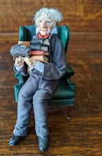 Scholarly old Gentleman with Escutcheon Leather Armchair