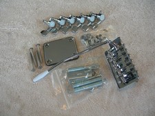 Chrome Strat Type Tremolo Bridge, 6 aside Strat Type Tuners, Neck plate & Screws