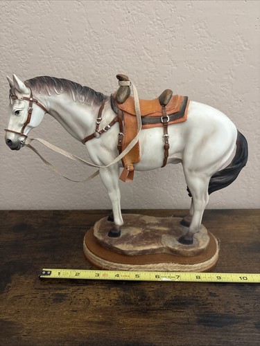 Resin horse figure on rock - figure,