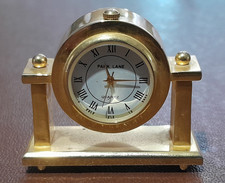Miniature Brass Park Lane Quartz Mantle Clock - round mounted on 2 pillars 