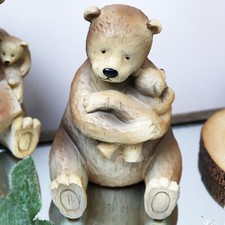 Bear and baby ornament loving - and,