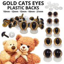 Gold cats eyes plastic backs - plastic,