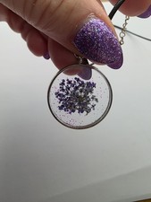 Clear Resin Pendant With A Purple Pressed Flower