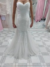 Size 8/10 by Disney for Alfred Angelo. Fit and flare dress, sample not worn. 