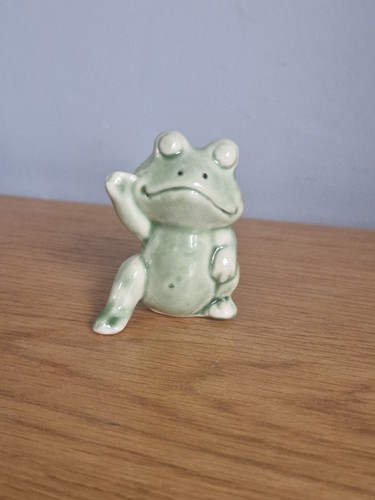 Small ceramic frog figurine