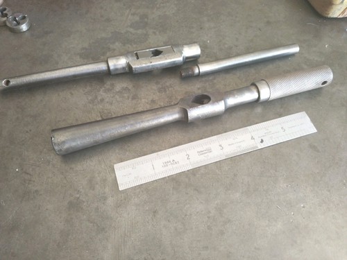 Pair engineers tap wrenches - ,
