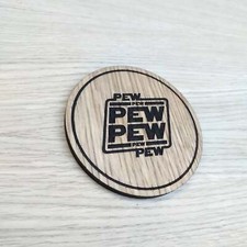 Laser cut wooden coaster. Pew