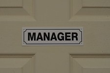 MANAGER sign or sticker