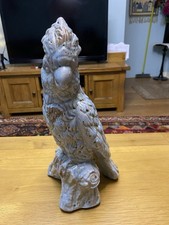 A glazed ceramic parrot