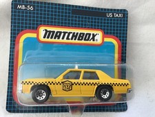 MATCHBOX MB56 FORD LTD U S TAXI - YELLOW - ON CARD