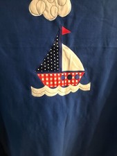 A Blanket For a Boys  Bed In Blue With a Sailing Boat Motif.