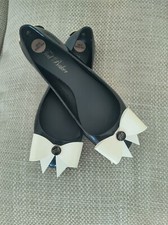 Ted Baker,nblack rubber ballerina style shoes with a bow, Uk size 3