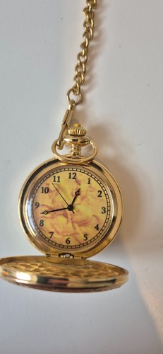 Gold tone horse and rider - and,