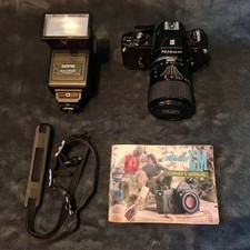 NIKON EM 35MM SLR CAMERA +