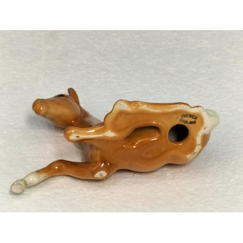 Beswick palamino foal laying - palamino,
