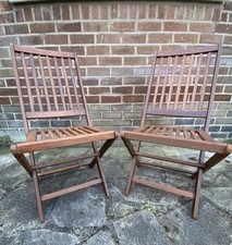 Pair of fold-up acacia wooden garden chairs with sturdy brass fixings - USED