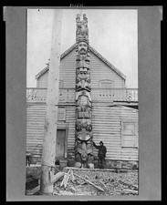 Photo:Man alongside large