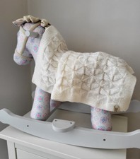 Hand knitted baby blanket in