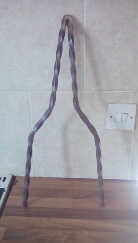 Twisted iron sissy bar