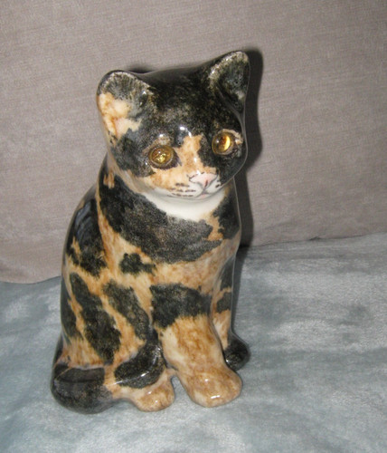 Winstanley tabby cat sitting - winstanley,