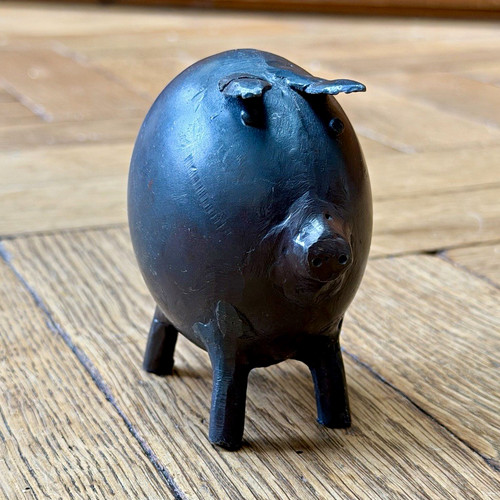 Vintage hand forged metal pig - hand,